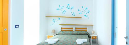 A bed or beds in a room at Camere D'Aragona