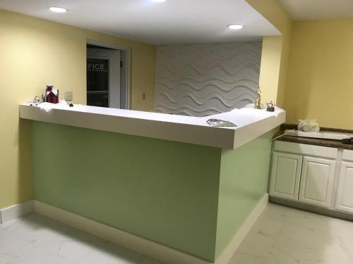 a bathroom with a sink and a counter top at Oasis Inn in Beaufort