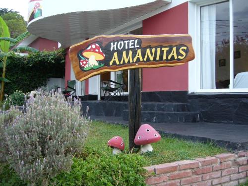 a sign in front of a hotel amannasi at Amanitas Hotel in Villa Carlos Paz