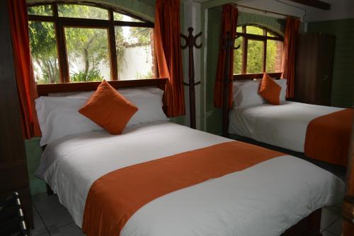 Postel nebo postele na pokoji v ubytování Hosteria Quinta Paraiso