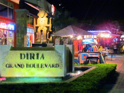 a sign in front of a restaurant at night at Tamarindo Condo 206 Matapalo in Tamarindo