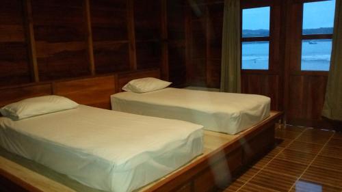 Ліжко або ліжка в номері Dolin Cottage