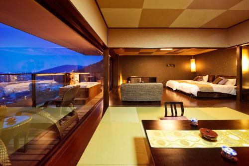 夕凪の湯 Hotel 花樹海にあるベッド