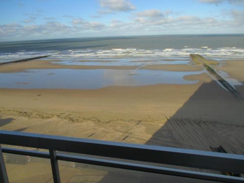 a view of the beach and the pyramid at Studio On The Beach With Sea View in Middelkerke