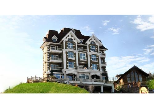 a large house on top of a hill at Pension Badawa in Gangneung