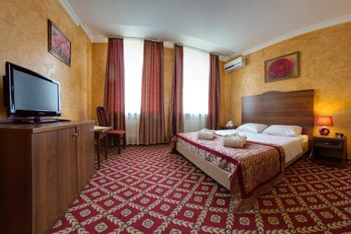 Postel nebo postele na pokoji v ubytování *Pirosmani Hotel