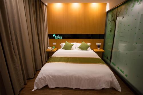 Katil atau katil-katil dalam bilik di Vatica Suzhou Yongqiao District Yinhe 2 Road Wanda Plaza Hotel