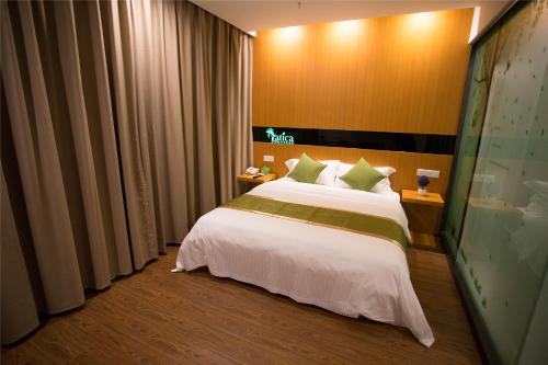 Katil atau katil-katil dalam bilik di Vatica Suzhou Yongqiao District Yinhe 2 Road Wanda Plaza Hotel