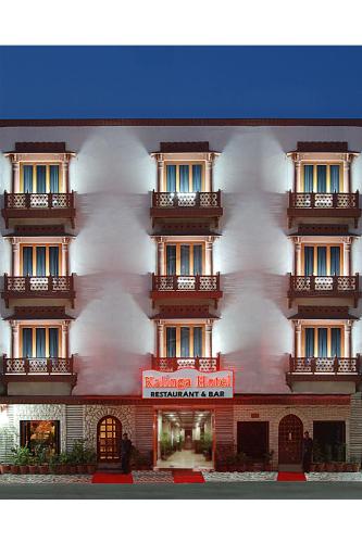 a building with a red sign in front of it at Kalinga Hotel in Jodhpur