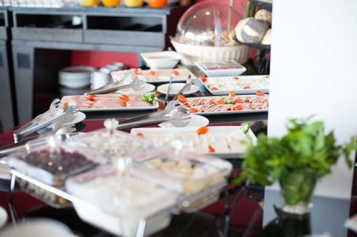 a buffet with many plates of food on a table at Aleph Boutique Hotel in Jbeil