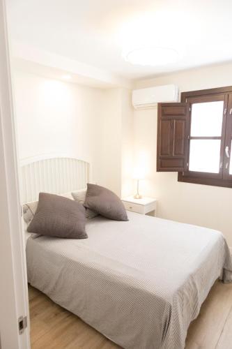 Ένα ή περισσότερα κρεβάτια σε δωμάτιο στο Apartamentos Sol Real