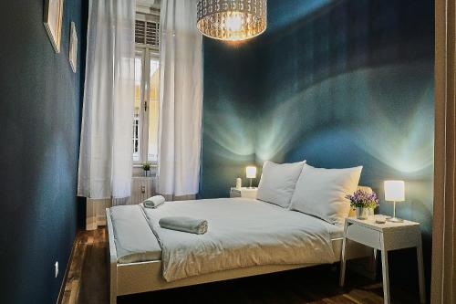 Кровать или кровати в номере ONYX Apartment