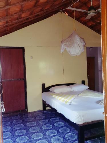 Cama o camas de una habitación en Sealand Beach Cottages