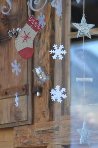 a group of christmas ornaments hanging on a wall at Apartment Champéry Grand Pré A in Champéry