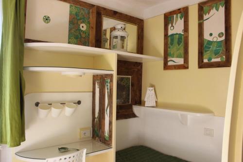 a bathroom with a sink and a toilet in a room at Country House Il Covo della Civetta in Barberino di Val dʼElsa