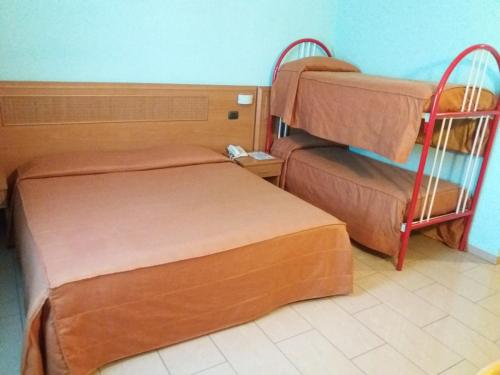 a room with two bunk beds in a room at Hotel Panorama in Cambiano