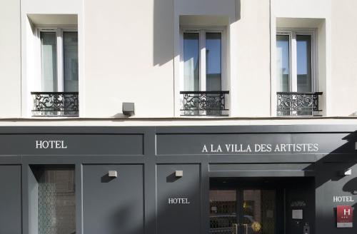 a facade of a building with a hotel at Hôtel A La Villa des Artistes in Paris