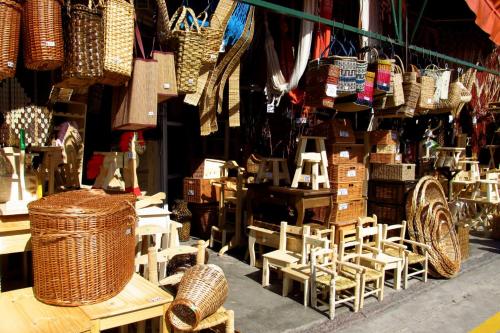 a store with wicker baskets and chairs in a room at Puerto Delta in Tigre