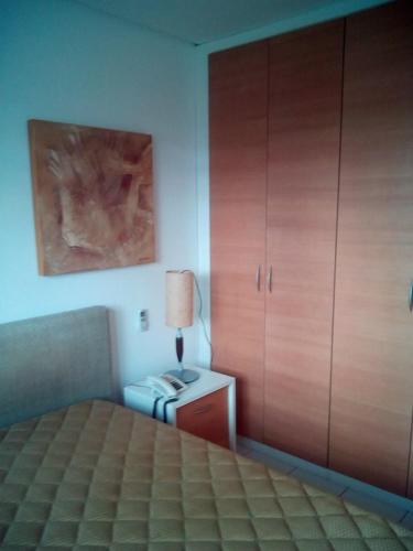En eller flere senge i et værelse på Flat Resort Marulhos