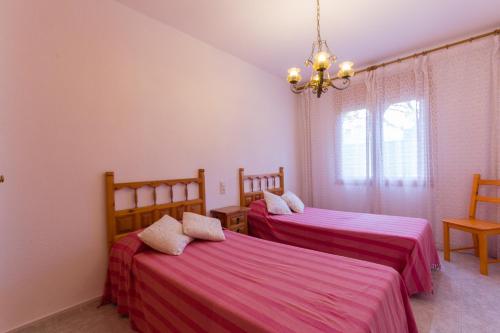 Posteľ alebo postele v izbe v ubytovaní INNOUTHOME Casa Piscina