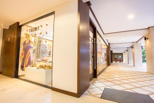 a hallway of a store with a shop window at Novotel Rayong Rim Pae Resort in Klaeng