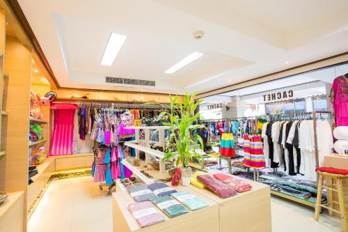 a store with a lot of clothes on display at Novotel Rayong Rim Pae Resort in Klaeng