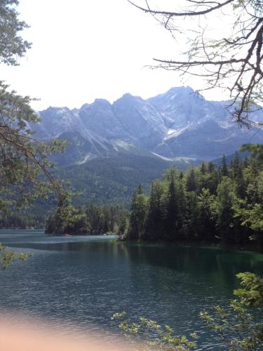 a view of a lake with mountains in the background at Ferienwohnung Blumäcker Oberbayern in Oberhausen