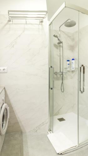 a shower with a glass door in a bathroom at Casa Baja Mojacar Pueblo in Mojácar