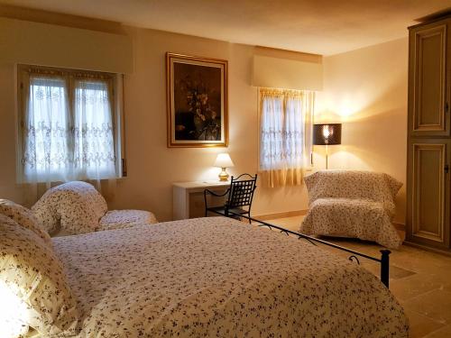 Postel nebo postele na pokoji v ubytování Foresteria Borgo Delle Grazie