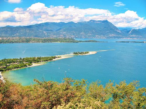 an island in the middle of a large body of water at Residence Bellavista in Manerba del Garda