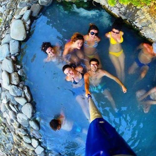 a group of people in a swimming pool at Funky Guest House & Adventures in Përmet