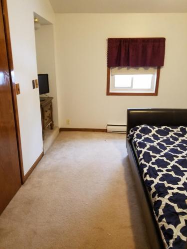 Postel nebo postele na pokoji v ubytování Cozy cottage on Lake Winnebago