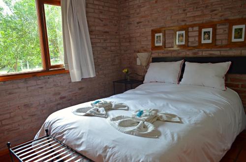 Una cama o camas en una habitación de Barlovento Apart & Spa