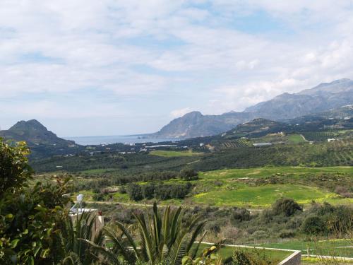 a view of a valley with mountains in the background at Plakias Villas in Lefkogeia