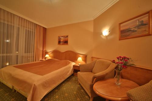 Postel nebo postele na pokoji v ubytování Hotel Polaris