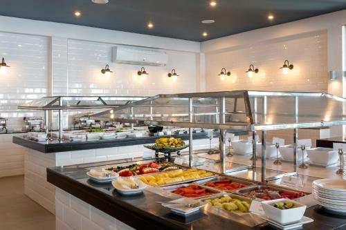 a buffet line with many different types of food at Sunwing Bangtao Beach in Bang Tao Beach