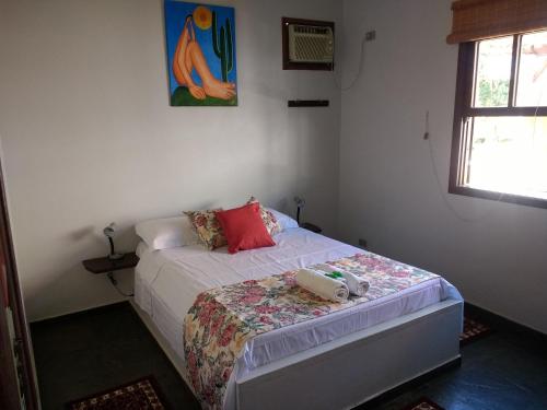 Ένα ή περισσότερα κρεβάτια σε δωμάτιο στο Residência Toca do Cação