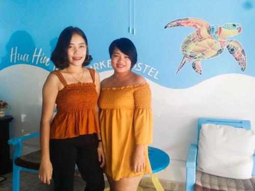 two women standing next to each other in a room at HuaHin Night Market Hostel in Hua Hin