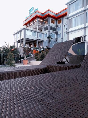 a view of a building with a roof at Hotel Santika Luwuk - Sulawesi Tengah in Luwuk