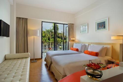 Tempat tidur dalam kamar di HARRIS Hotel & Conventions Malang