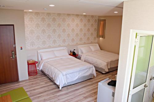 Llit o llits en una habitació de 星月文旅溫泉民宿