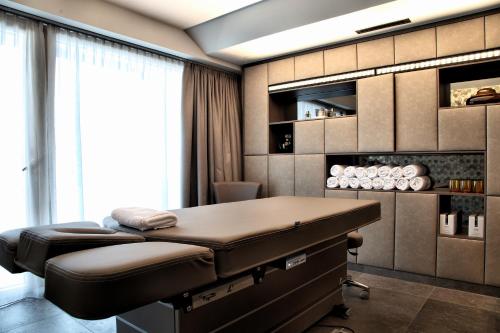 a massage room with a bed in a room at Elizabeth Arthotel Adults Only in Ischgl