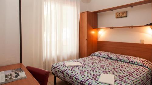 Posteľ alebo postele v izbe v ubytovaní Hotel Taormina