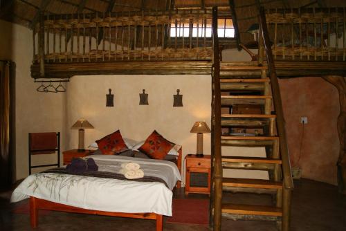 En eller flere senger på et rom på Weltevreden Country Guest Lodge