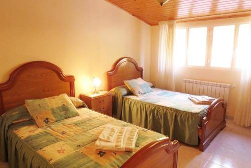 Ένα ή περισσότερα κρεβάτια σε δωμάτιο στο Hospedaje Pension Tabares