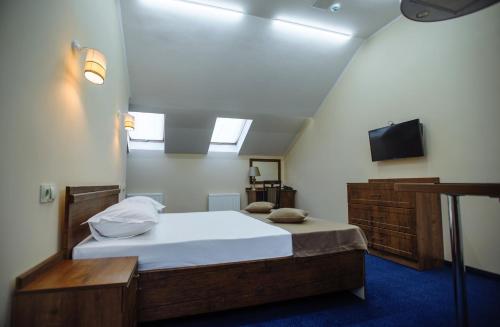 Кровать или кровати в номере Astoria