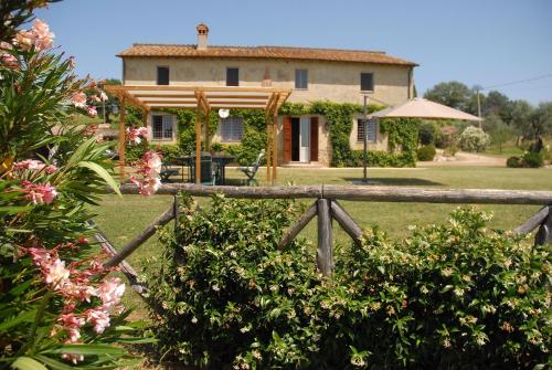 a house with a fence in front of it at Podere San Giovanni in Montoro