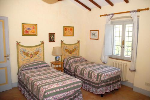 Katil atau katil-katil dalam bilik di Podere San Giovanni