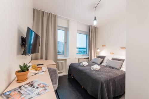 Ένα ή περισσότερα κρεβάτια σε δωμάτιο στο Forenom Hostel Jyväskylä