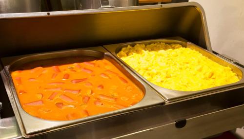 two trays of food in a restaurant kitchen at Hotel Atlântico Travel Copacabana in Rio de Janeiro